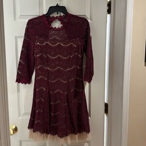 Burgundy lace dress with cream tool ruffle.